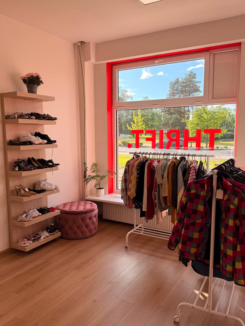 Second-hand clothing on display at THRIFT. thrift shop in Ādaži.